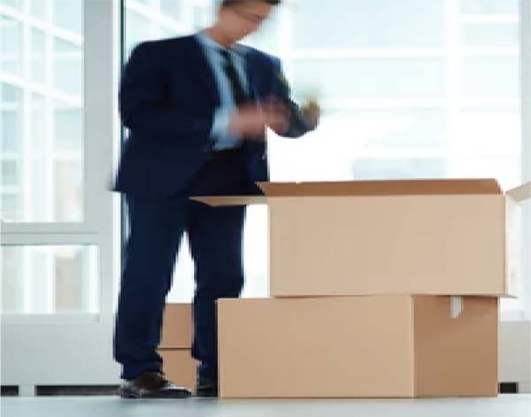 man packing boxes quickly